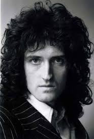 A portrait photo of Brian May