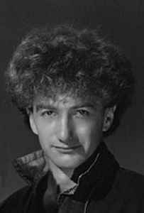 A portrait photo of John Deacon