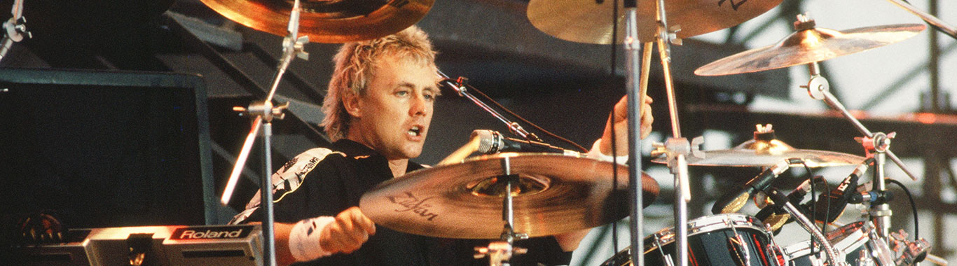Photo of Roger Taylor playing drums on stage