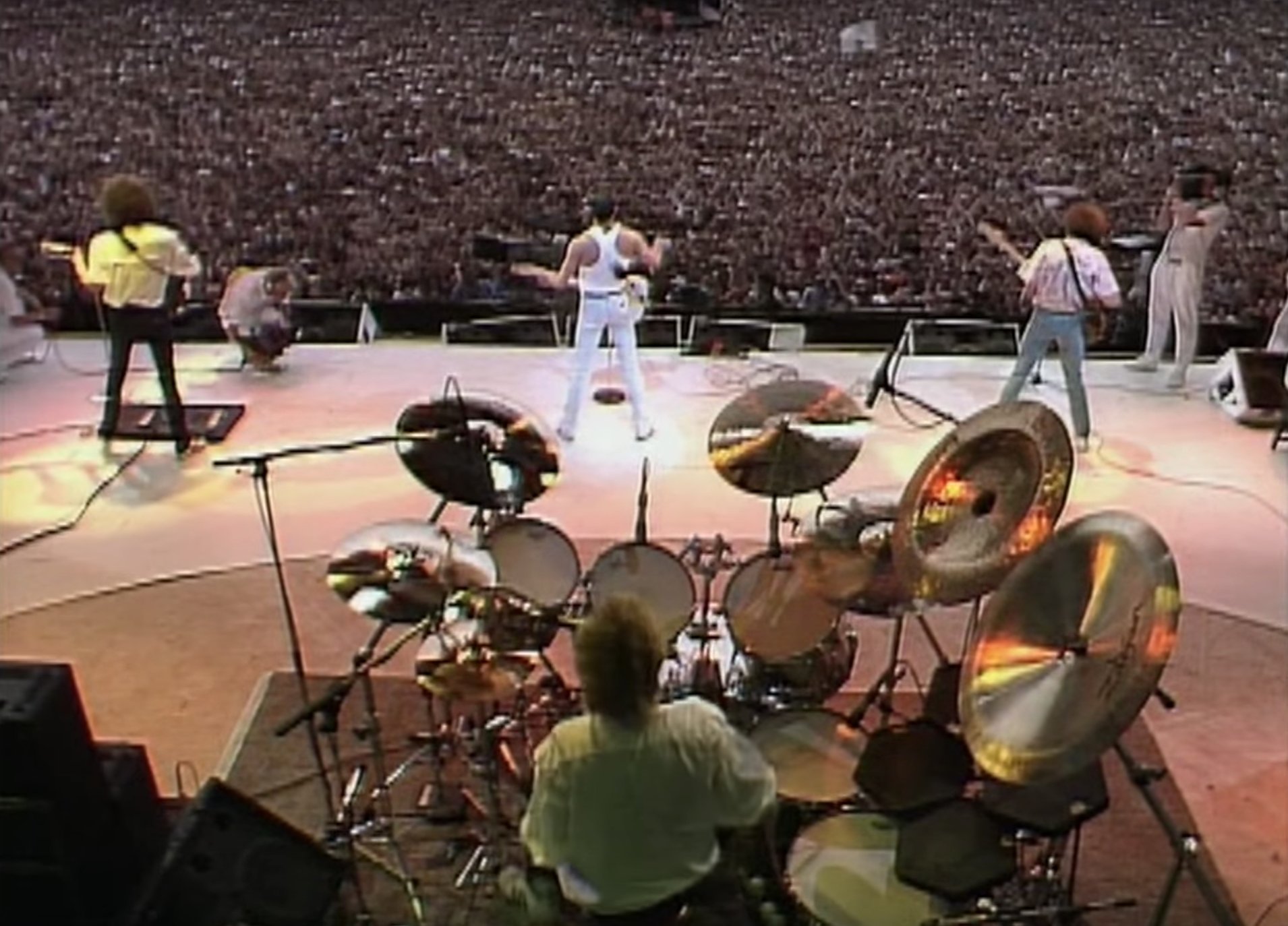 Back view of Queen performing at Wembley